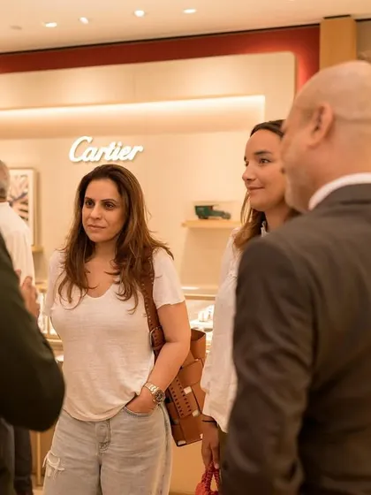 Mingling with guests at the Timevallee luxury watch boutique launch in Mumbai, with the iconic Cartier storefront in the background. My close-up magic is tailored to suit the sophisticated atmosphere of high-end brand events.