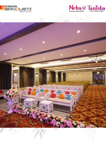 We blend spectacular decor with functional design. This seating arrangement at Mohan Banquets features comfortable lounge sofas with colorful cushions, lined with a beautiful floral border.