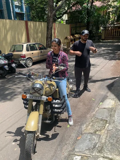 A moment of pure happiness during a training ride. This graduate is clearly enjoying her newfound freedom on two wheels.
