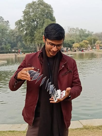 A card spring by the lake. The beauty of nature provides a perfect backdrop for the art of magic.