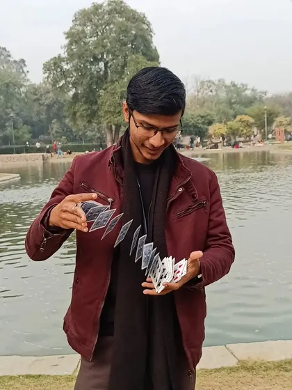 A card spring by the lake. The beauty of nature provides a perfect backdrop for the art of magic.