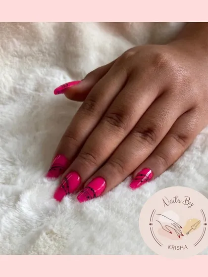 This look was created using soft gel tip extensions, which are quick and lightweight. I added a simple but edgy spider gel art design over a bright pink base.