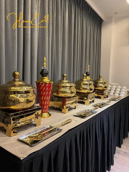 Another perspective of our premium gold serving ware, showing the intricate details that elevate the look of our buffet.