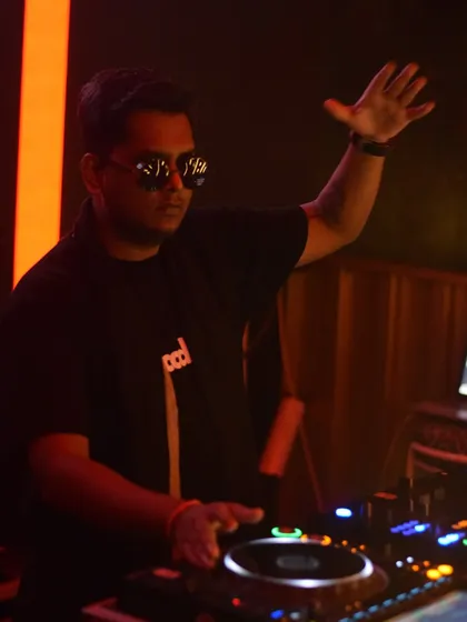 Another shot from a club night, getting ready to drop the next track. The hand gesture shows I'm ready to hype up the crowd.