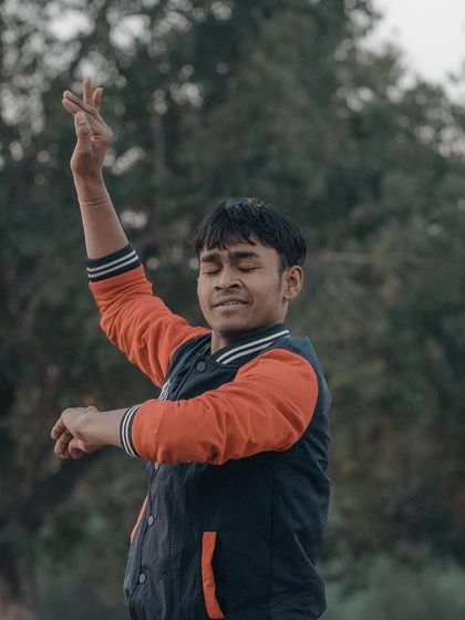 A dancer lost in his performance in a park near India Gate. Capturing artists in their element results in such expressive and powerful street portraits.