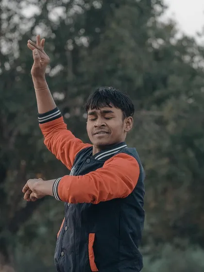 A dancer lost in his performance in a park near India Gate. Capturing artists in their element results in such expressive and powerful street portraits.