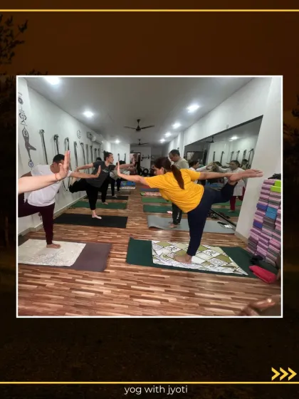 A class full of yogis in Natarajasana, each finding their own expression of the pose.