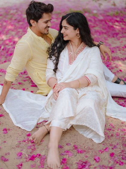Sitting amongst fallen bougainvillea, this shot is a celebration of romance in full bloom. We love finding unique, colorful settings for our couple shoots.