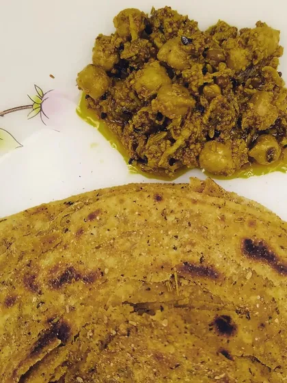 My Ghissu Aam Chana Achaar is a unique creation, pictured here with a lachcha paratha. It's made with grated raw mango and boiled chickpeas, all mixed in a lip-smacking masala.
