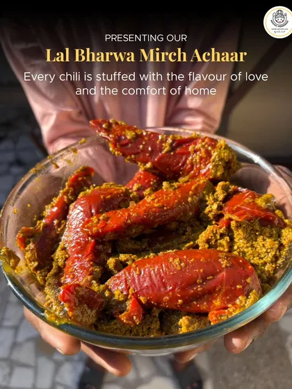 This is where it all began. My Lal Bharwa Mirch Achaar is more than a pickle; it's a story of a mother's love, packed in a jar to feel like home, no matter where you are. Each chili is hand-stuffed with spices and care, just for you.