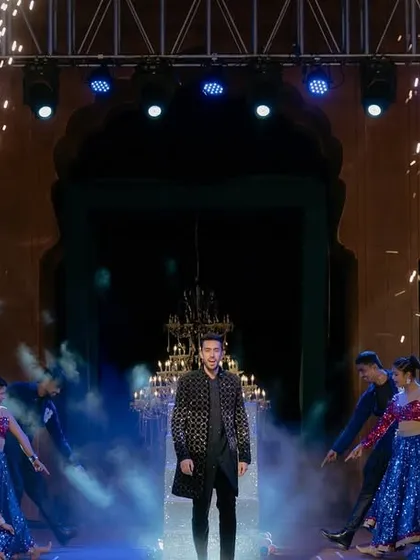 The groom's entry needs to have power and impact. Here, we designed a high-energy moment with cold pyro, smoke effects, and our backup dancers creating a pathway for a true star entrance.