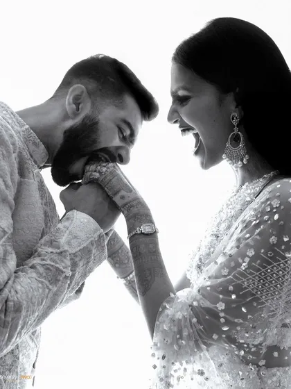 Forget the perfect smiles. I live for these moments of pure, unapologetic fun. This playful bite is a testament to a love that is comfortable, real, and full of laughter.