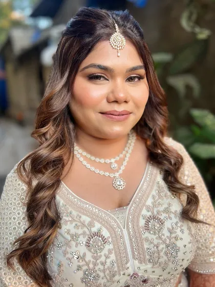 Ready for her event, this client looks confident and beautiful with her party-ready makeup and hair.