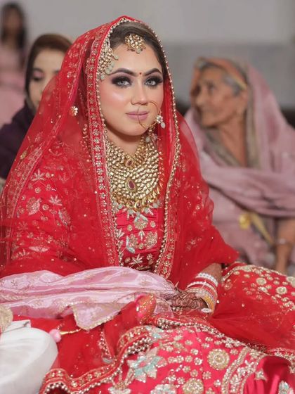 The bride during her ceremony. The makeup is designed to be long-lasting and photogenic, looking perfect from the start to the end of the long day.