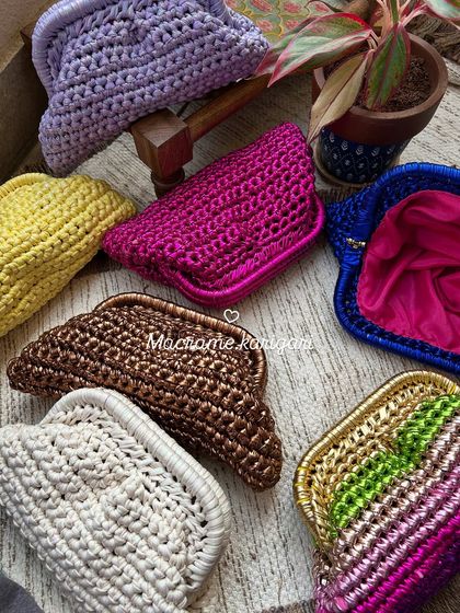 Our collection of handmade metallic and cotton yarn clutches. Available in a rainbow of colors from shimmering bronze to vibrant pink, each one is lined and perfect for a night out.