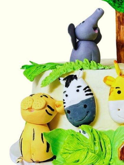 Another detail shot of the animal farm cake, showing the little tiger, zebra, and elephant. Every animal is sculpted with care to be both cute and delicious.