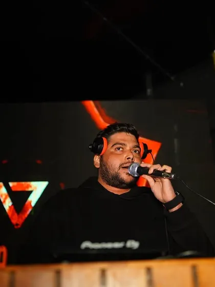 On the mic, in the zone, and ready to drop the next banger. This is me in my element, controlling the vibe and keeping the energy high all night long.