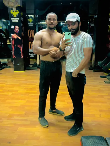 A gym session with my bade bhai (elder brother). We are doing a chest workout together, pushing each other to be better.
