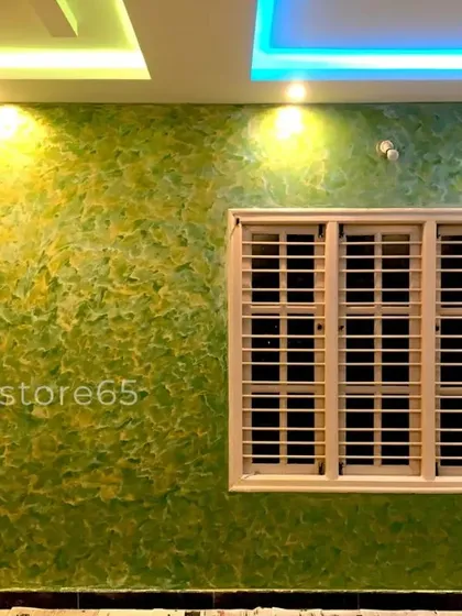 Don't be afraid of color. This vibrant living room wall features a custom-blended green and yellow texture, creating a fresh and energetic feel. The finish, applied by hand, has a soft, organic look that catches the light beautifully.