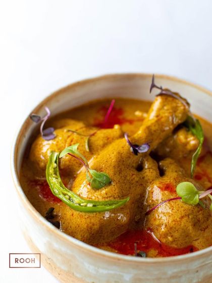 A closer view of the Chicken Dum Curry, showing the tender pieces of chicken coated in the luscious, spiced sauce. It’s a perfect main course for a soulful meal.