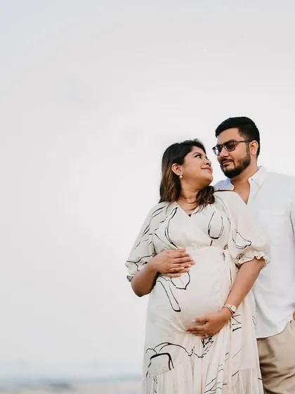 Another lovely shot from a beachside maternity session. Her makeup is kept fresh and minimal, ensuring the focus remains on the happy couple and this special time.
