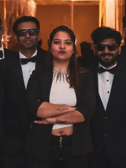 The band posing together, looking sharp in our coordinated outfits for a wedding gig.