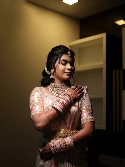 A dramatic, low-light shot of the bride, creating a moody and artistic feel.