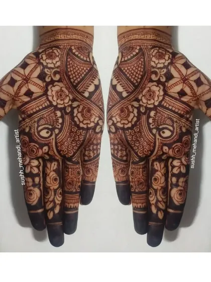 A close-up of a beautiful floral and paisley design on the palms. This is a timeless pattern that suits everyone.