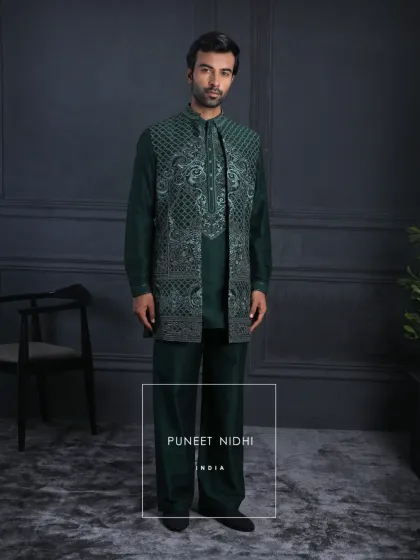 The full view of the emerald kurta set and embroidered jacket. The straight cut and mandarin collar are hallmarks of my impeccable craftsmanship.