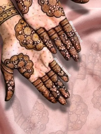 An elegant floral design perfect for siders or guests. The delicate flowers and flowing patterns are a great example of modern henna artistry.