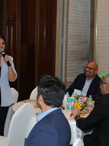 Leading a fun, interactive session with attendees at their tables. My approach ensures that even senior management can relax and enjoy the event.