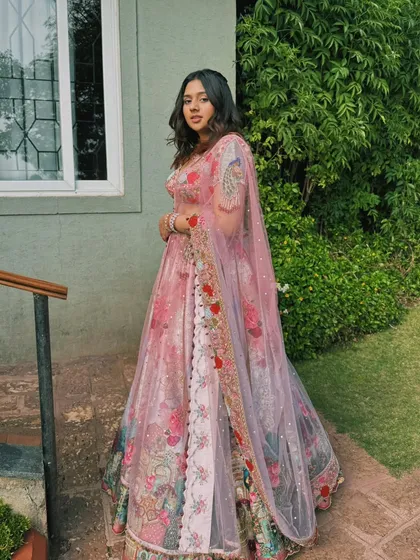 Another view of the beautiful floral lehenga, showing how the soft makeup look is perfect for a daytime event.