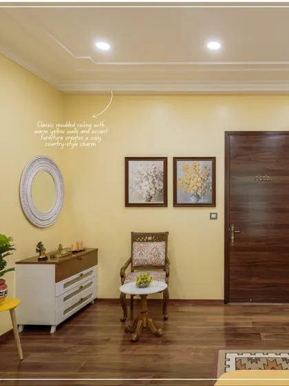 A corner of the bedroom from image 24, showing a country-style chest of drawers and warm wooden floors.