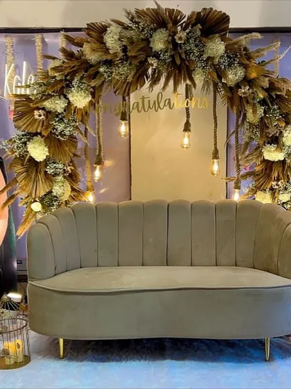 We were so honored to celebrate two brilliant sisters with this custom boho-chic decor. The setup features a lush arch of dried pampas grass and white florals, warm Edison bulb lighting, and elegant lanterns to create a sophisticated and celebratory atmosphere.