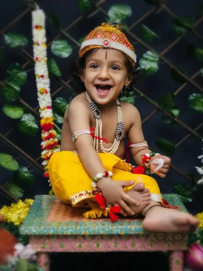 Another adorable shot from the Krishna themed session. His happy, open-mouthed laugh shows just how much fun we have during these creative photoshoots.