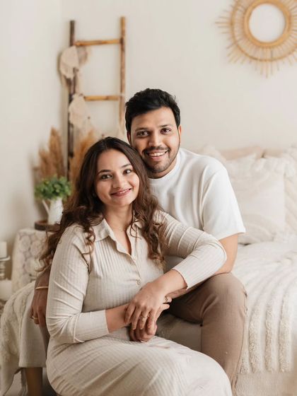 A classic portrait of the parents, showcasing their connection before the little one joins the fun.