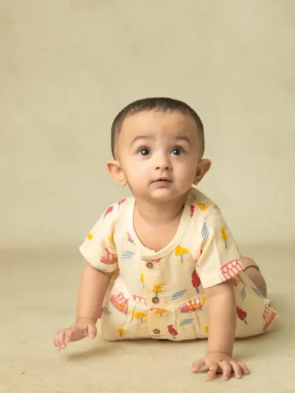 A collection of simple, classic portraits of twin babies. Without props or themes, their individual expressions and connection are beautifully highlighted.