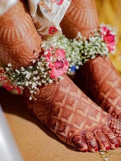 I also create delicate floral accessories like these anklets, or payals. Made with baby's breath and small pink flowers, they add a beautiful, unique touch to your mehendi or haldi look.