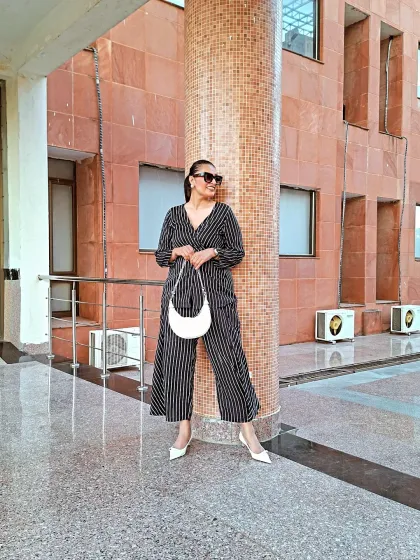 Breaking the mold with this striped co-ord set. The relaxed fit is all about comfort, while the vertical stripes and wrap top create a chic, elongated silhouette. Perfect for women who prioritize comfort without sacrificing style.
