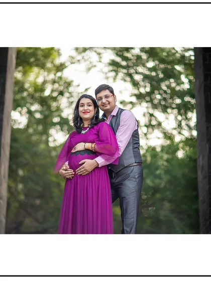 A classic couple's pose, perfect for showcasing the beautiful gown and the loving embrace.