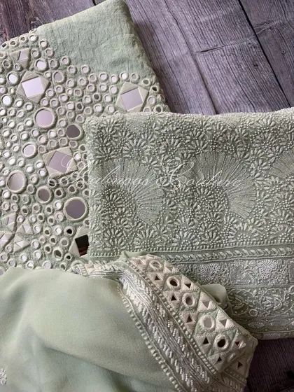 Another folded view, focusing on the mirrorwork border of the dupatta.