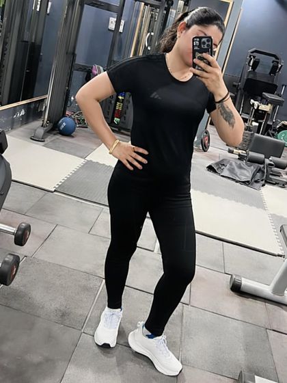 A mirror selfie in my favorite all-black gym outfit. Feeling powerful and ready to train.