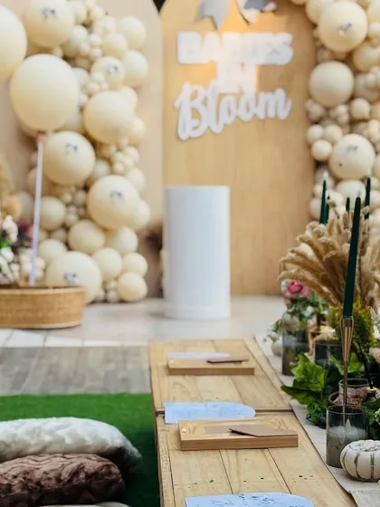The floor seating arrangement with plush cushions, set against the backdrop of the beautiful boho decor.