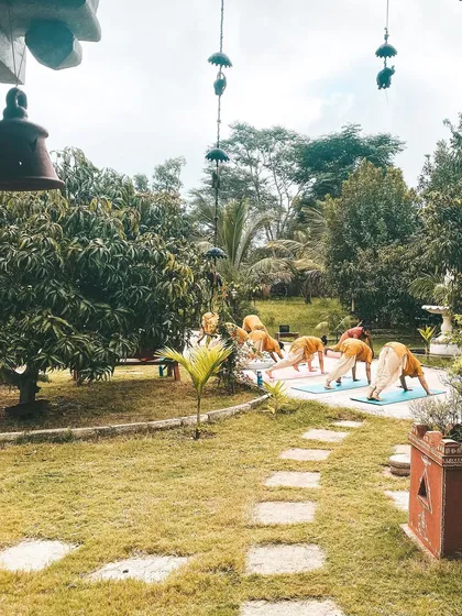 The ashram grounds provide a beautiful and serene backdrop for our outdoor yoga sessions. Practicing surrounded by lush greenery connects us deeply to the earth.