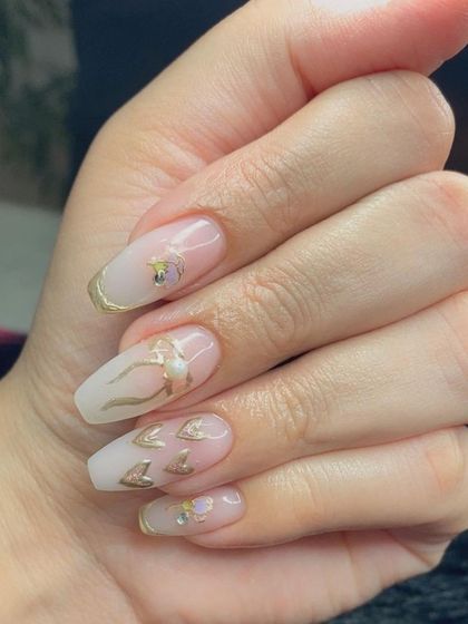 A close-up of the delicate gold chrome hearts and bows.