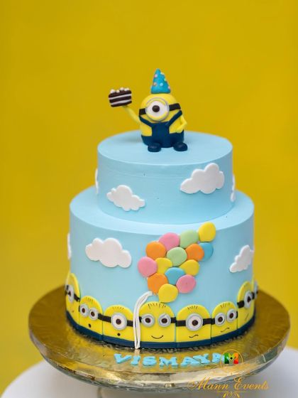 The showstopper for any birthday is the cake. This two-tiered Minion-themed cake was as fun as it was delicious, featuring a party-hat-wearing Minion on top and playful details that tied the whole theme together.
