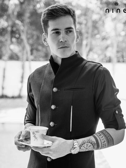 Our "Metal Bling" collection features modern silhouettes with subtle metallic details. This black layered kurta set is a perfect example, offering a sharp, contemporary take on traditional wear.