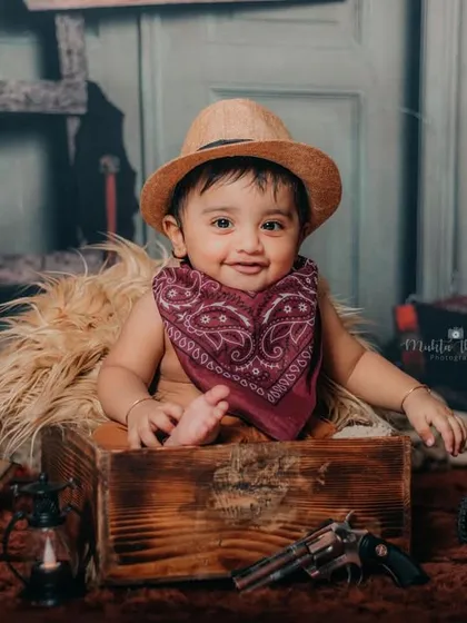 The happiest little cowboy you'll ever meet. That smile is pure gold.