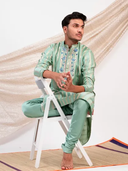 The relaxed yet polished silhouette of the striped mint green kurta set, perfect for a guest who values both comfort and style at a wedding event.