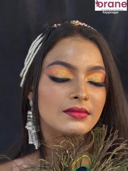A close-up of the Arabic-inspired eye makeup, showing the beautiful blend of gold and orange glitter.